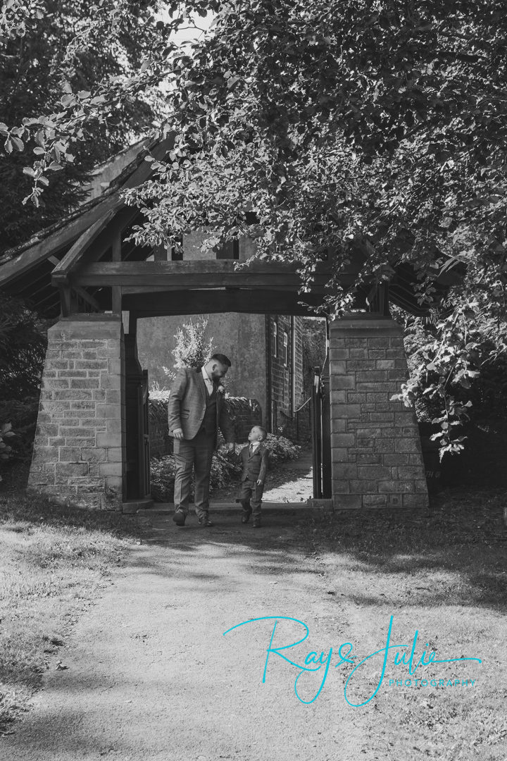 Father and son having a moment together, prior to going into the church for the wedding ceremony 