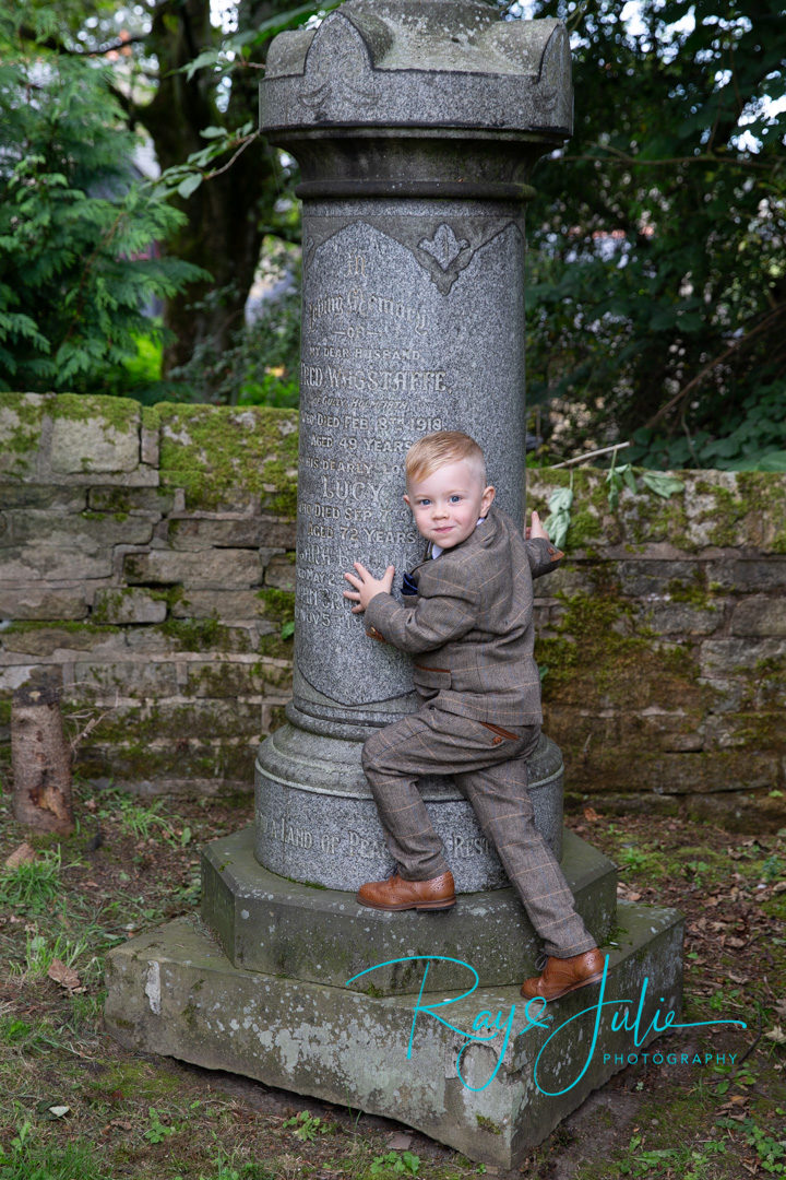 Boys will be boys. Pageboy free after being sat still in the church, someone looks happy