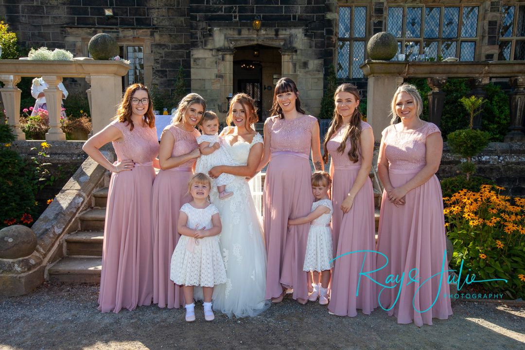 A very happy bridal party outside Woodsome Hall