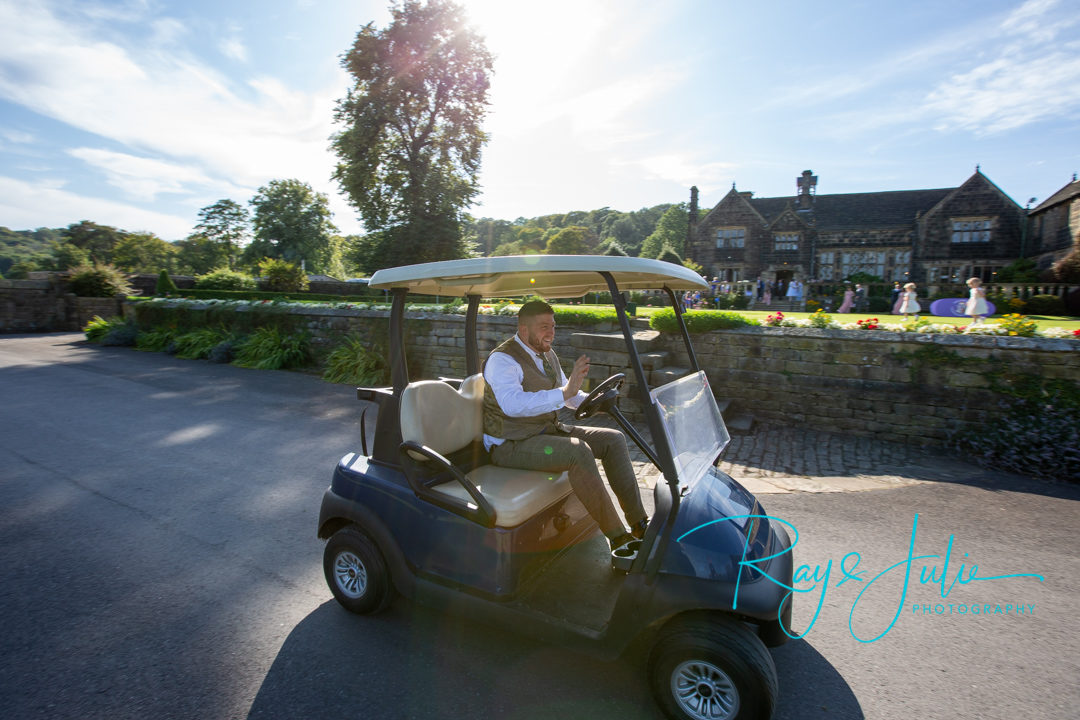 Bestman racing in a golf buggy at Woodsome Hall