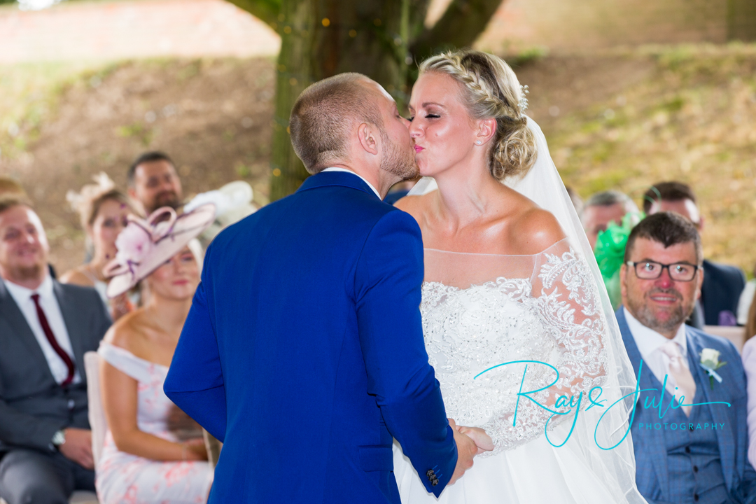 The First Kiss! Captured at Saltmarshe Hall outdoor ceremony.