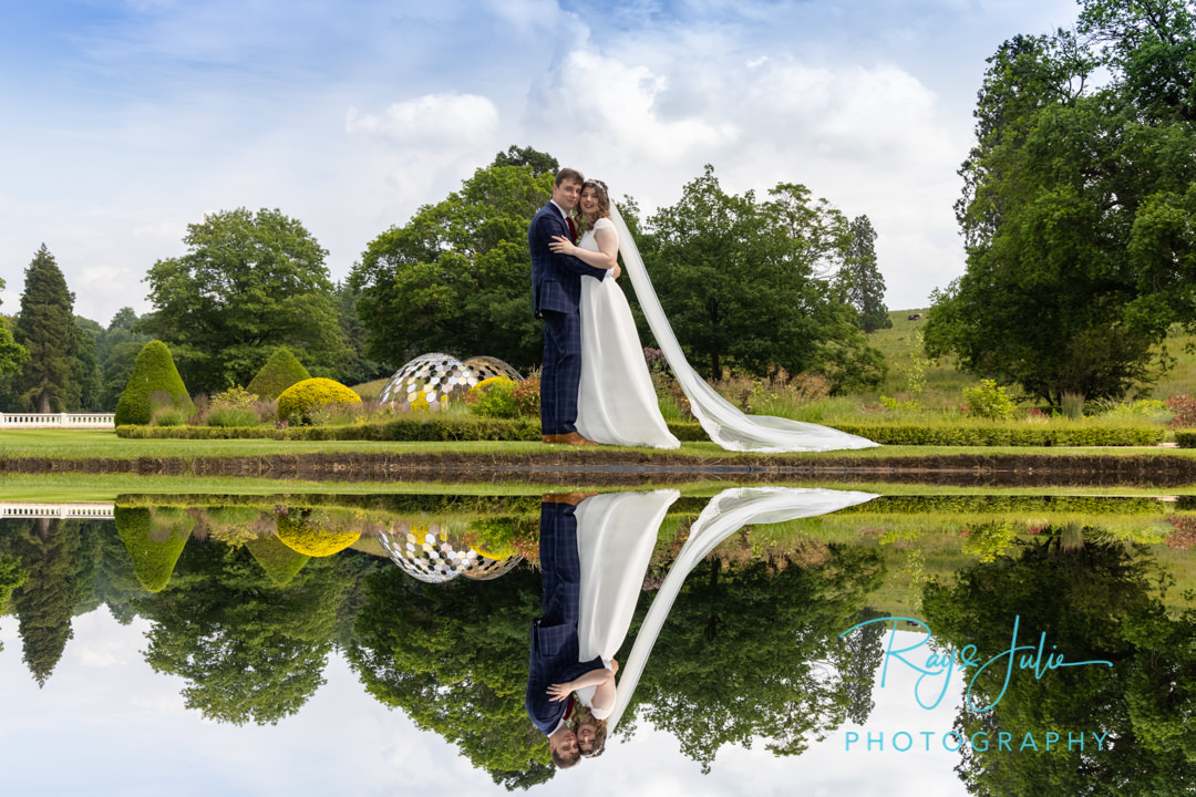 Beautiful reflection of wedding couple taken in the grounds at Grantley Hall