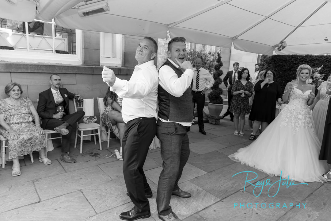 Father of the bride busting some moves with his daughter watching on at Saltmarshe Hall