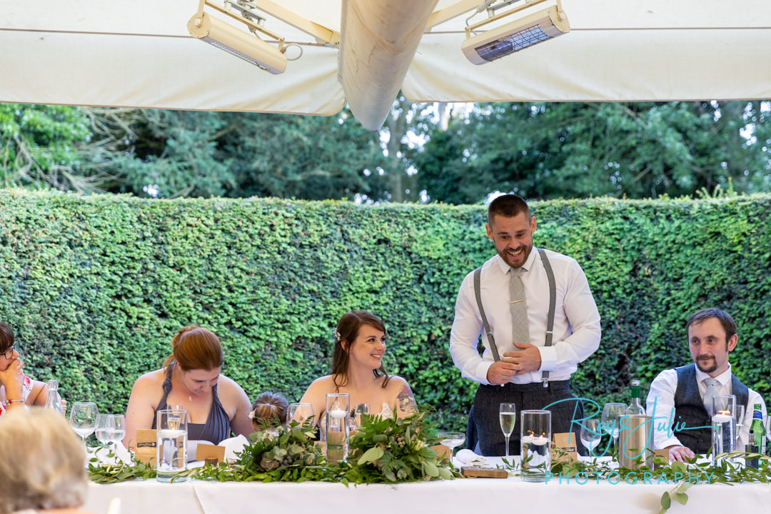 Groom doing his speech during wedding reception