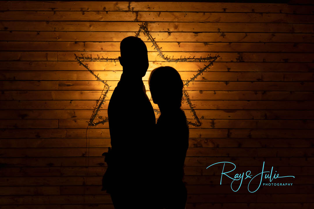 Wedding silhouette of bride and groom with a star behind them.