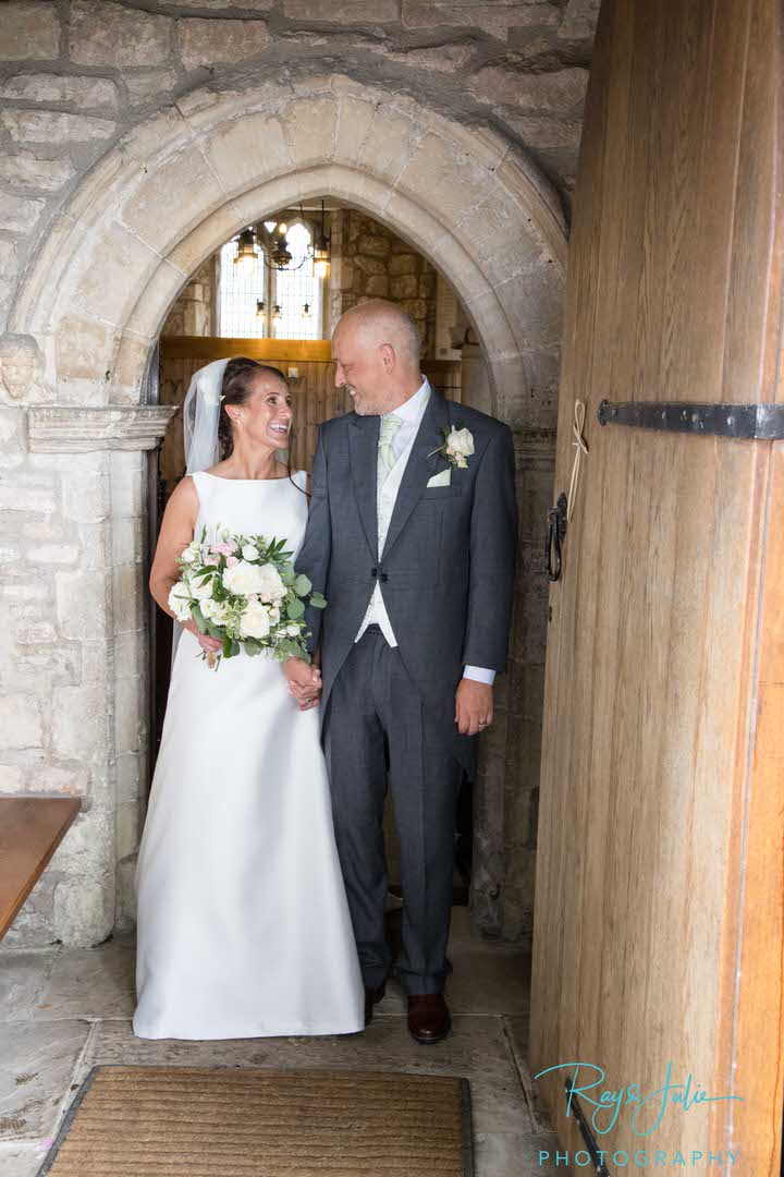 Bride and Groom leaving the church after getting married