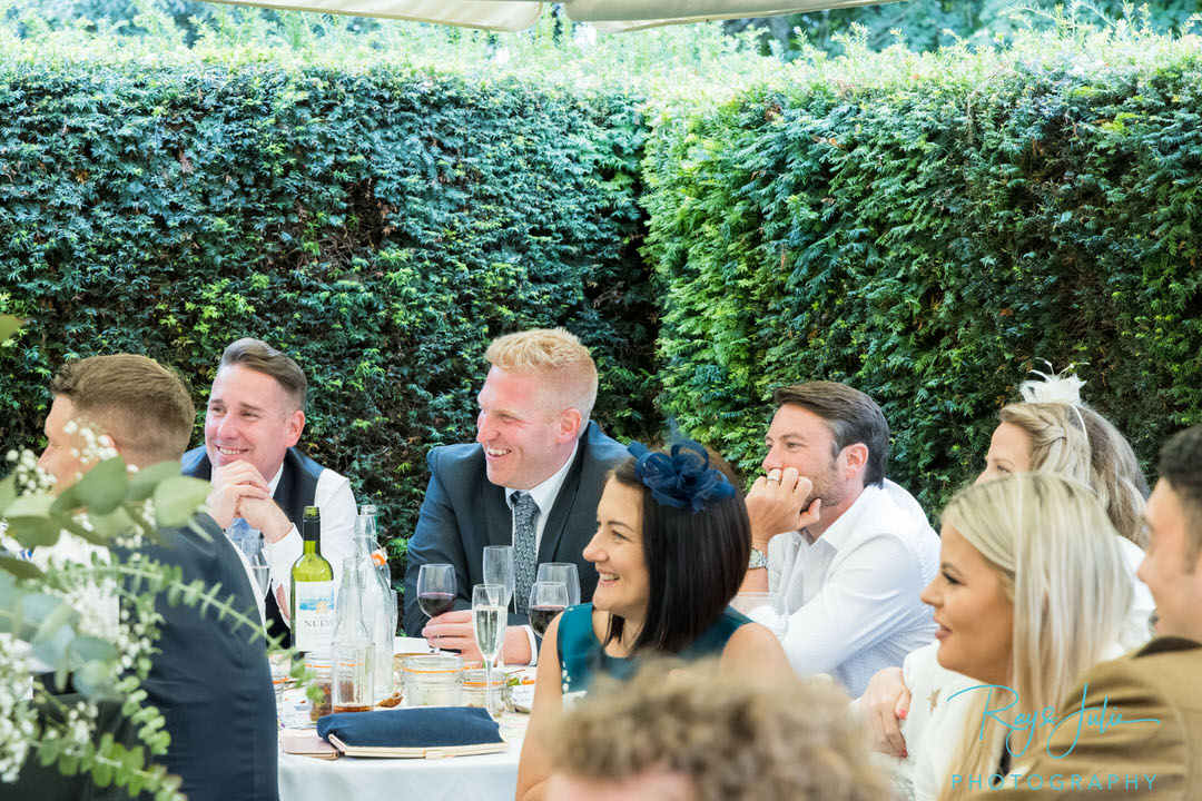Wedding guests laughing during speeches - Yorkshire wedding photographer - Saltmarshe Hall